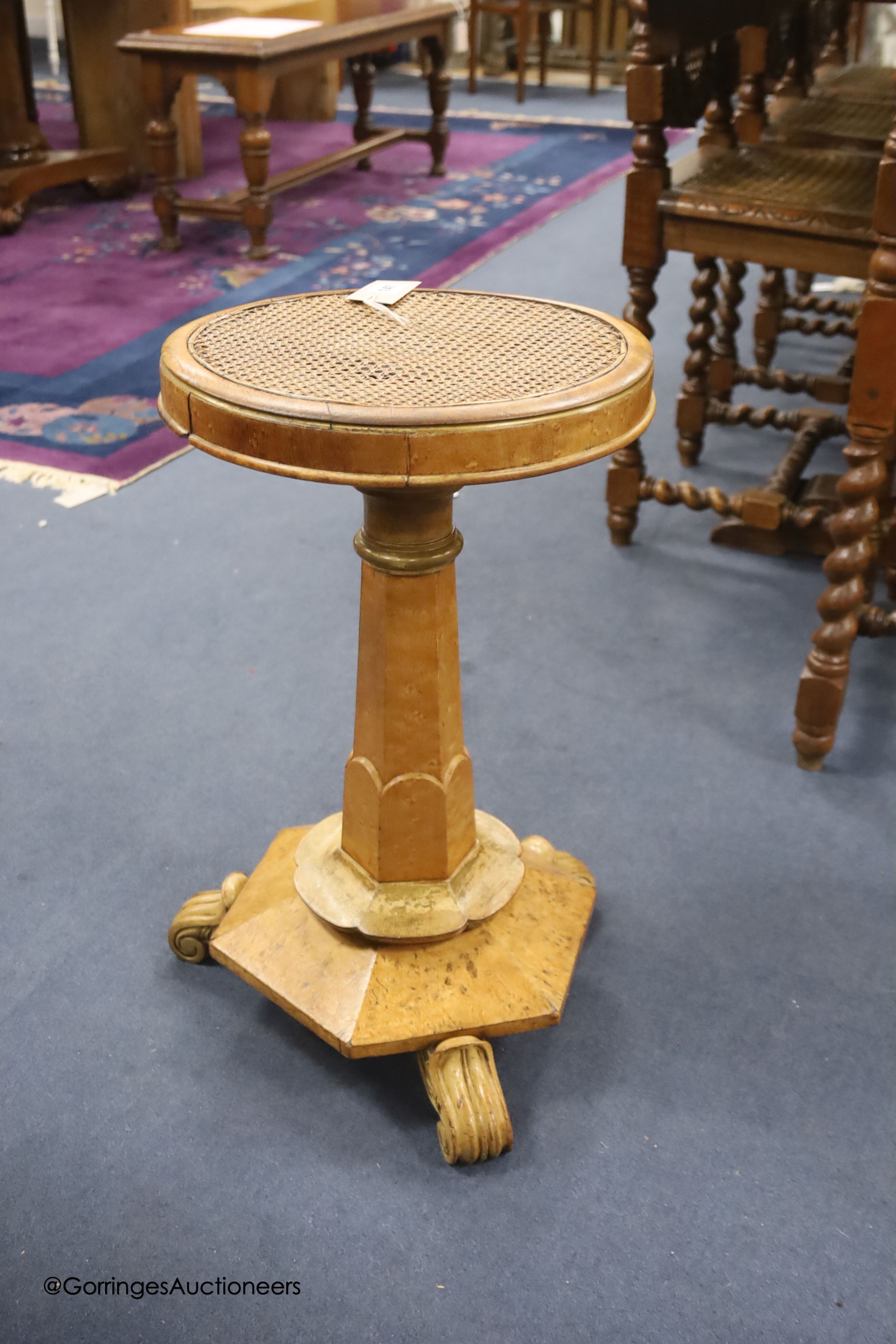 A 19th century bird's eye maple cane seated dressing stool